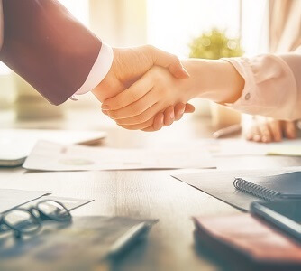 Shaking hands across a table