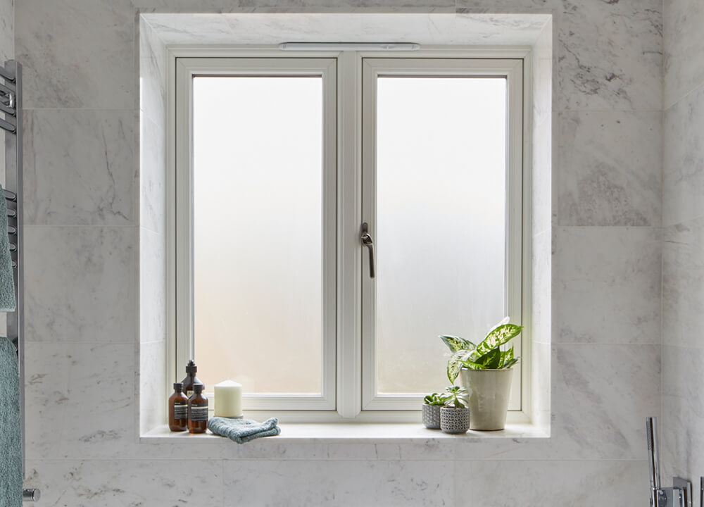 White casement window in a bathroom